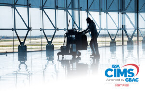 airport employee pushing cleaning cart